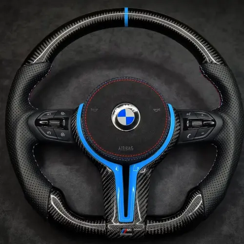 Perforated Black leather, Sport shape frame, Gloss Twill Carbon fibre with M sport Light blue detailing