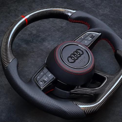 Beautiful Audi wheel in black perforated leather, Gloss twill 2x2 Carbon with red top marker and stitching and matching leather airbag cover
